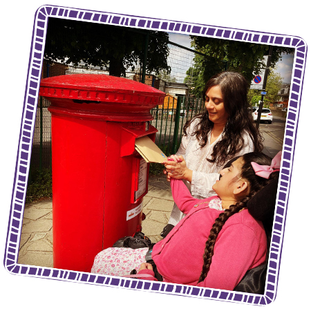 Rhea posting some of her orders with her mum.
